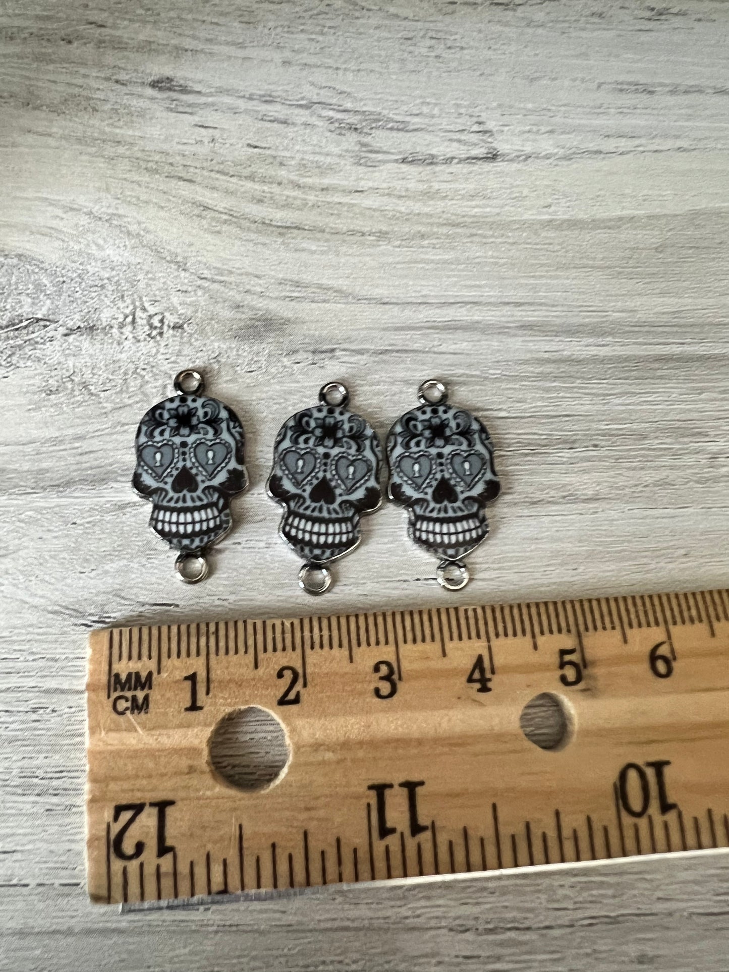 Black candy skull charms