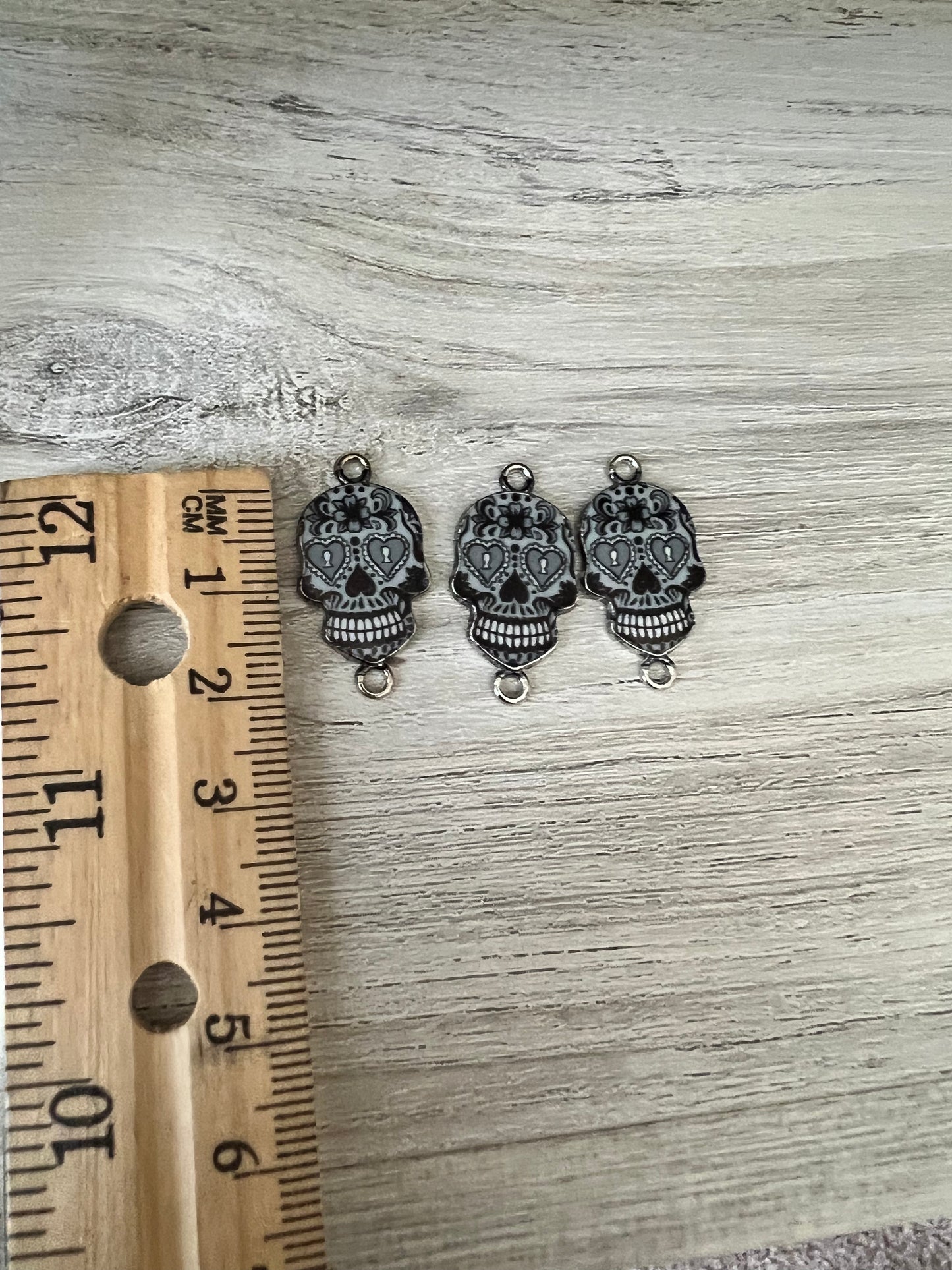 Black candy skull charms