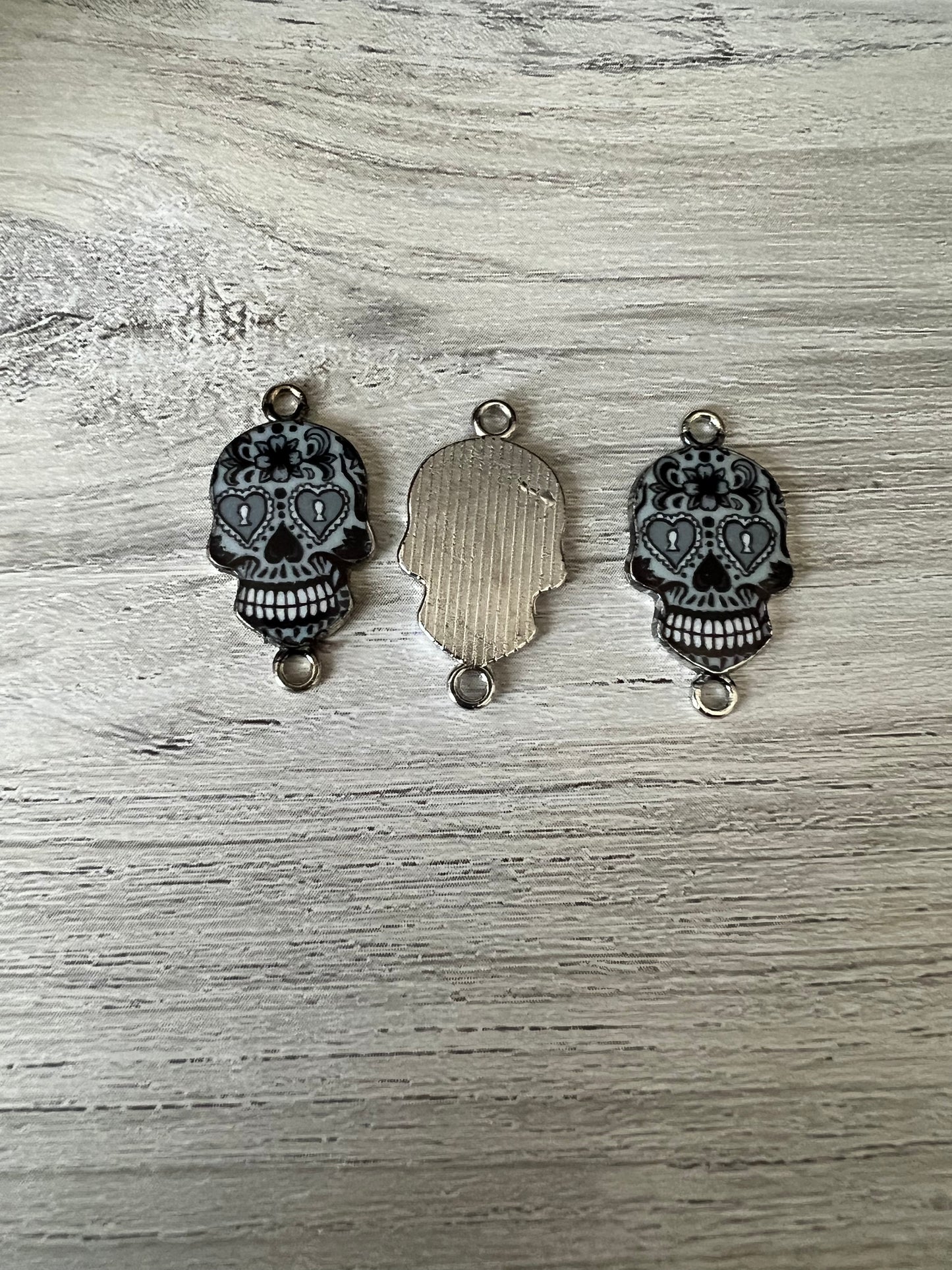 Black candy skull charms